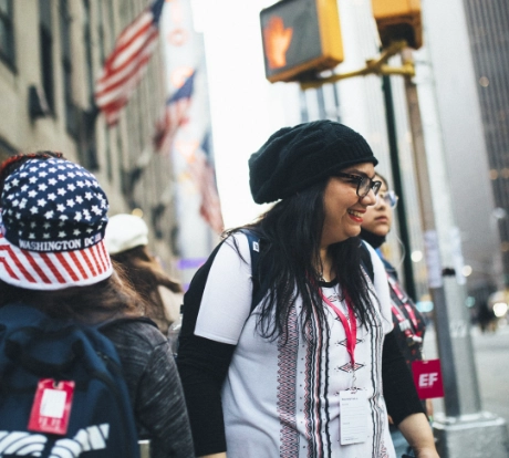 A teacher leads her students through NYC on a class trip